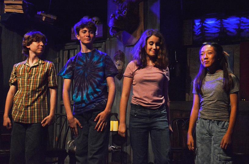 four kids perform ArtReach's play