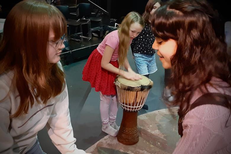 Kids play drums in Jungle Book Play
